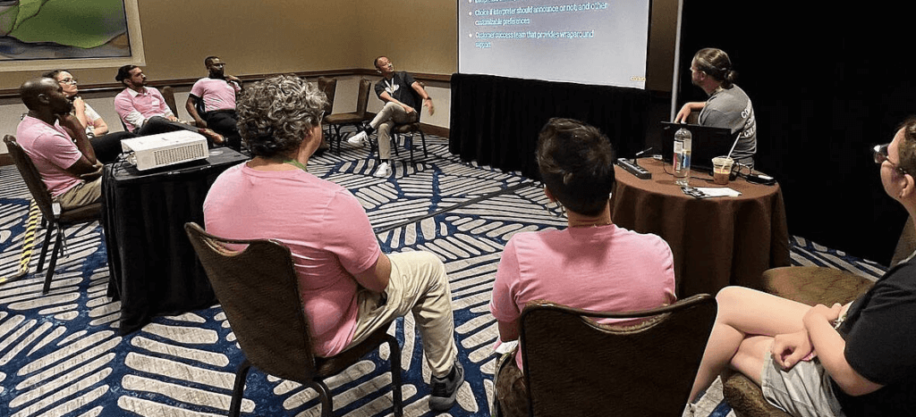 People sitting around listening to a presentation